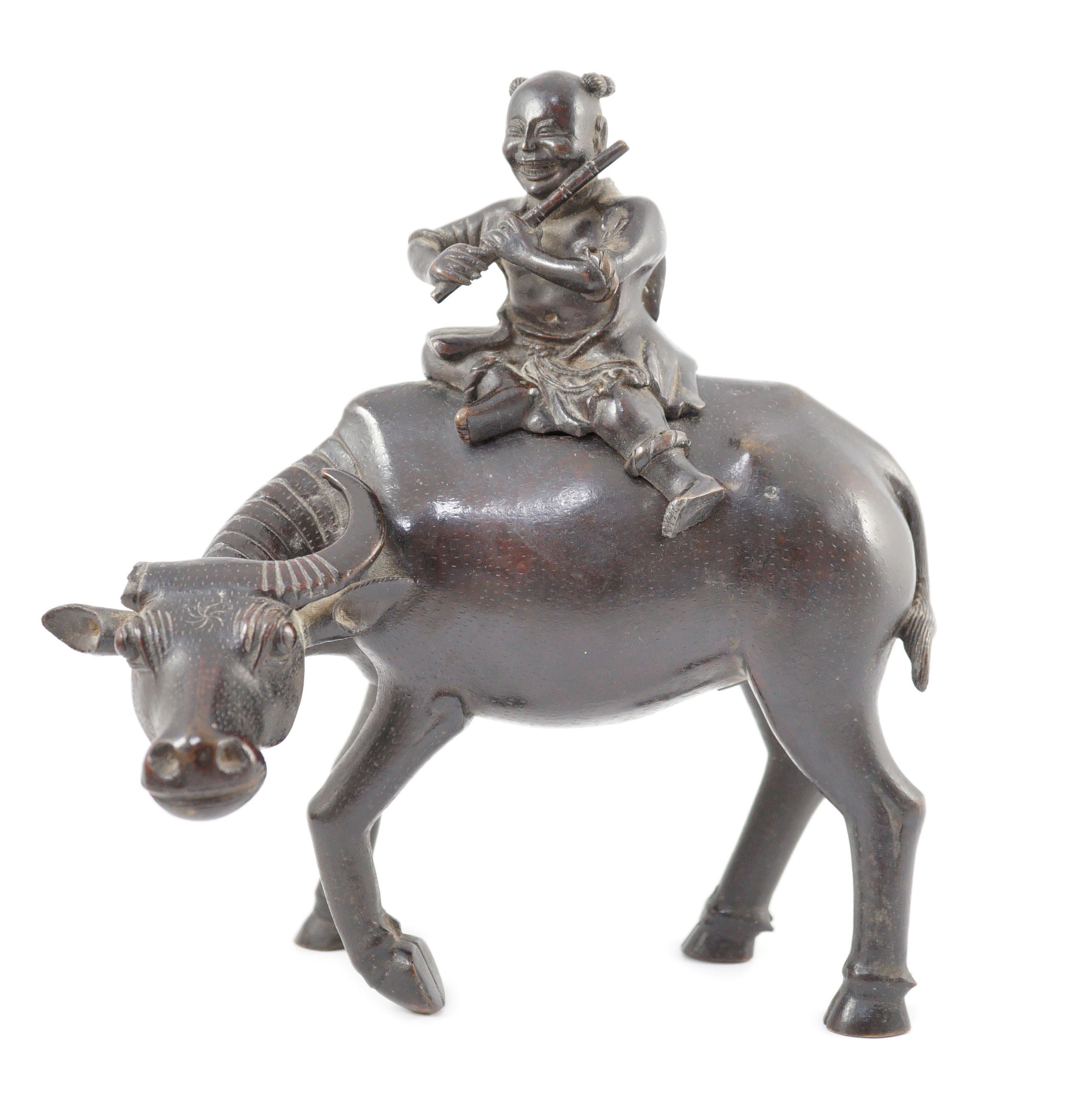 A Chinese bronze ‘boy riding a water buffalo’ censer, 17th/18th century, 22.5cm long, one horn detached but present